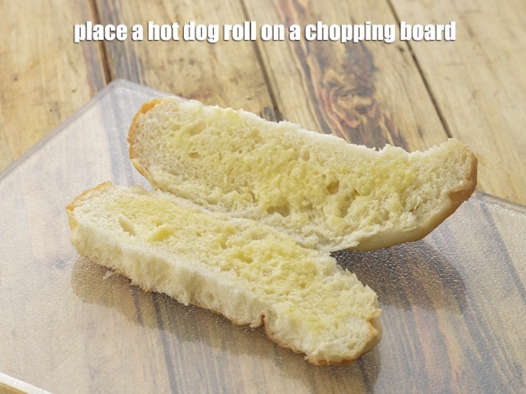 Step 4 – <p>Place a <strong>hot dog roll</strong> on a chopping board.</p>