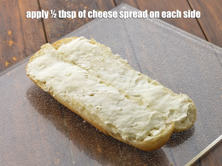 Step 9 – <p><span style="background-color:rgb(255,255,255);color:rgb(0,0,0);">Apply ½ tbsp. of </span><a href="https://www.tarladalal.com/glossary-cheese-spread-309i"><u>cheese spread</u></a><span style="background-color:rgb(255,255,255);color:rgb(0,0,0);"> on each side.</span></p>