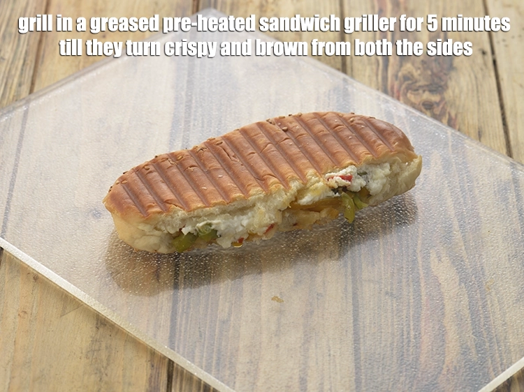 Step 22 – <p><span style="background-color:rgb(255,255,255);color:rgb(0,0,0);"><strong>Grill</strong> in a <strong>greased pre-heated sandwich griller</strong> for 5 minutes till they turn crispy …