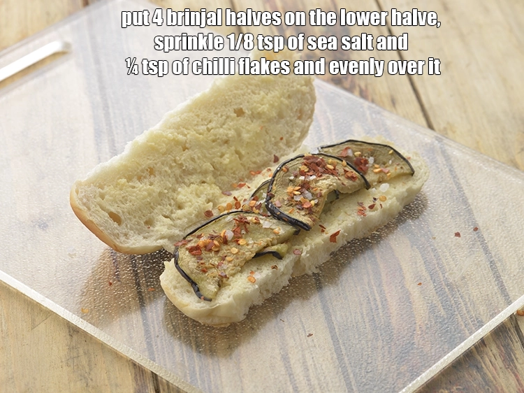 Step 10 – <p><span style="background-color:rgb(255,255,255);color:rgb(0,0,0);">Put 4 <strong>brinjal </strong>halves on the lower halve, sprinkle 1/8 tsp of </span><a href="https://www.tarladalal.com/glossary-salt-namak-table-salt-418i#ing_2804"><u>sea …