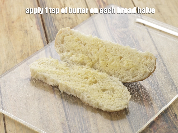 Step 9 – <p><span style="background-color:rgb(255,255,255);color:rgb(0,0,0);">Apply 1 tsp of </span><a href="https://www.tarladalal.com/glossary-butter-makhan-233i"><u>butter&nbsp;</u></a><span style="background-color:rgb(255,255,255);color:rgb(0,0,0);"> on each bread halve.</span></p>