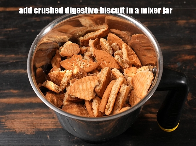 Step 10 – <p><span style="background-color:rgb(255,255,255);color:rgb(0,0,0);">To make the <strong>Layered Fruity Custard</strong>, add the crushed </span><a href="https://www.tarladalal.com/glossary-digestive-biscuit-207i"><u>digestive biscuit</u></a><span style="background-color:rgb(255,255,255);color:rgb(0,0,0);"> in …