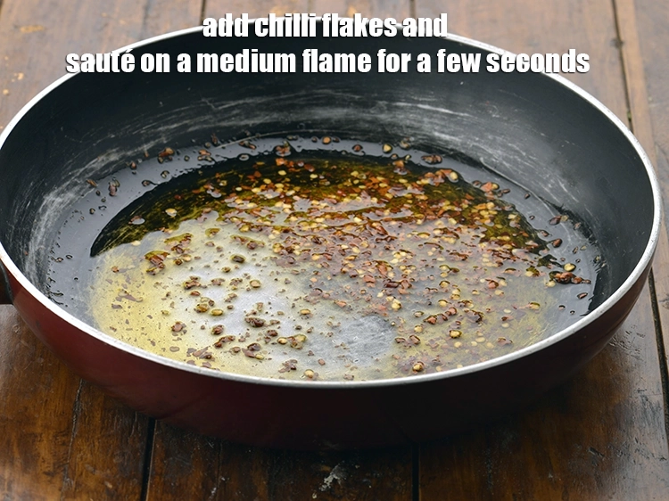 Step 2 – <p><span style="background-color:rgb(255,255,255);color:rgb(0,0,0);">Add the 1 tsp </span><a href="https://www.tarladalal.com/glossary-dry-red-chilli-flakes-paprika-338i"><u>dry red chilli flakes (paprika)</u></a><span style="background-color:rgb(255,255,255);color:rgb(0,0,0);"> and <strong>sauté</strong> on …