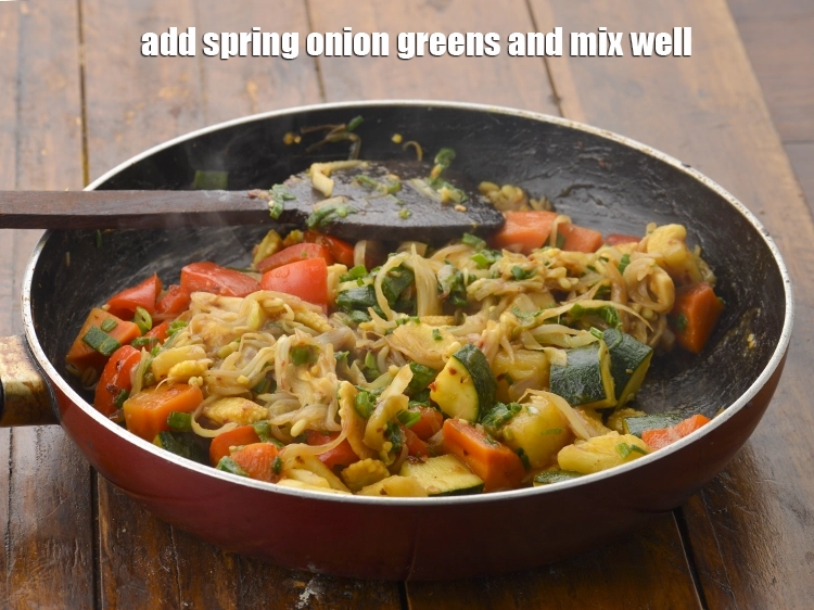 Step 5 – <p><span style="background-color:rgb(255,255,255);color:rgb(0,0,0);">Add the 1/4 cup finely </span><a href="https://www.tarladalal.com/glossary-spring-onion-greens-hare-pyaz-ke-patte-445i#ing_2424"><u>chopped spring onion greens</u></a><span style="background-color:rgb(255,255,255);color:rgb(0,0,0);"> and mix well.</span></p>