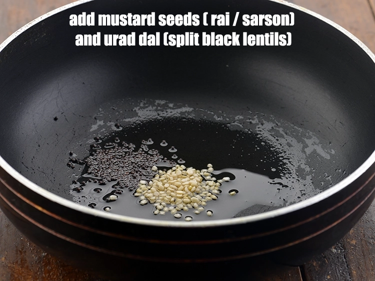 Step 8 – <p>Add the <span style="background-color:rgb(255,255,255);color:rgb(0,0,0);">1/2 tsp </span><a href="https://www.tarladalal.com/glossary-mustard-seeds-sarson-rai-sarson-ke-beej-525i"><u>mustard seeds ( rai / sarson)</u></a> into it. Also, …