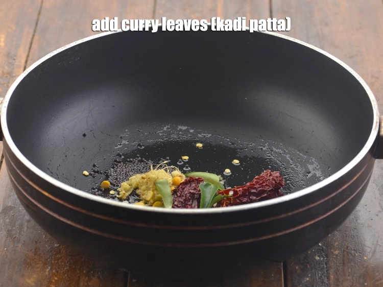 Step 11 – <p>Add the <span style="background-color:rgb(255,255,255);color:rgb(0,0,0);">4 to 5 </span><a href="https://www.tarladalal.com/glossary-curry-leaves-kadi-patta-kadipatta-388i"><u>curry leaves (kadi patta)</u></a></p>