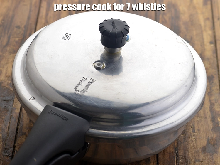 Step 38 – <p><span style="background-color:rgb(255,255,255);color:rgb(0,0,0);">Close the lid and pressure cook for 7 whistles.</span></p>