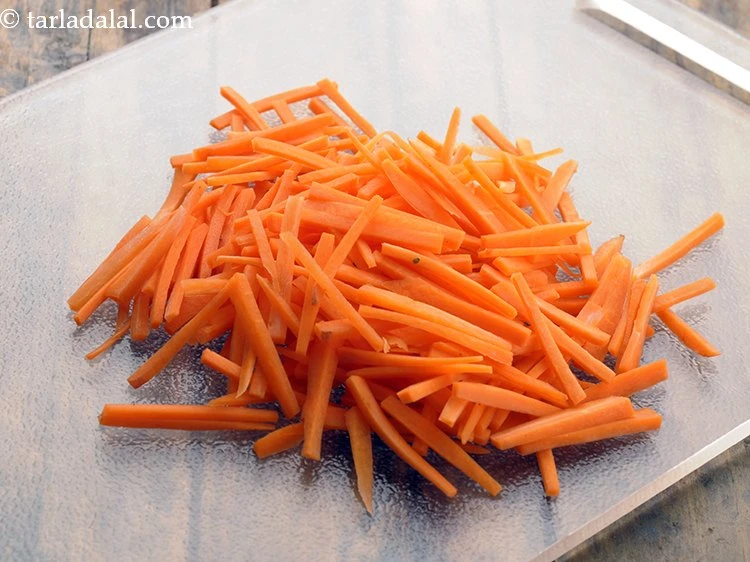 Step 6 – <p>Using a sharp knife slice the carrots.&nbsp;</p>
