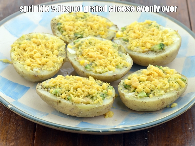 Step 11 – <p><span style="background-color:rgb(255,255,255);color:rgb(0,0,0);">Sprinkle ½ tbsp. of </span><a href="https://www.tarladalal.com/glossary-processed-cheese-315i#ing_3090"><u>grated processed cheese</u></a><span style="background-color:rgb(255,255,255);color:rgb(0,0,0);"> evenly over each stuffed potato …