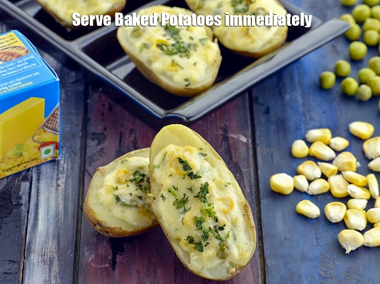 Step 10 – <p><span style="background-color:rgb(255,255,255);color:rgb(0,0,0);">Serve <strong>Baked Potatoes with Corn and Green Peas</strong> immediately.</span></p>
