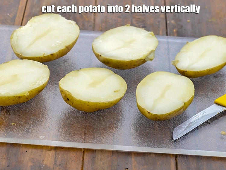 Step 4 – <p><span style="background-color:rgb(255,255,255);color:rgb(0,0,0);">Cut each 4 </span><a href="https://www.tarladalal.com/glossary-par-boiled-potatoes-711i"><u>par-boiled potatoes</u></a><span style="background-color:rgb(255,255,255);color:rgb(0,0,0);"> into 2 halves vertically with help of …