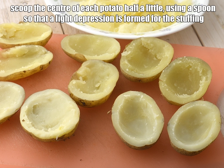 Step 4 – <p><span style="color:rgb(13,13,13);">Scoop the centre of each potato half a little, using a spoon so that …