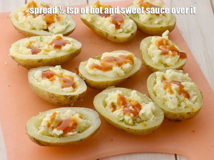 Step 9 – <p><span style="color:rgb(13,13,13);">spread ½ tsp of hot and </span><a href="https://www.tarladalal.com/glossary-sweet-chilli-sauce-1306i"><u>sweet chilli sauce</u></a><span style="color:rgb(13,13,13);"> over it.</span></p>