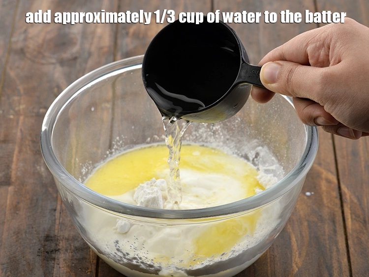 Step 6 – <p><span style="background-color:rgb(255,255,255);color:rgb(0,0,0);">Finally add approximately </span><span style="color:rgb(13,13,13);">1/3</span><span style="background-color:rgb(255,255,255);color:rgb(0,0,0);"> cup of </span><strong>water</strong><span style="background-color:rgb(255,255,255);color:rgb(0,0,0);"> to the batter.</span></p>
