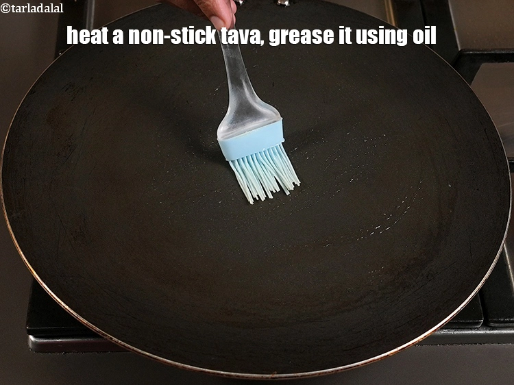 Step 29 – <p><span style="background-color:rgb(255,255,255);color:rgb(0,0,0);">heat a non-stick tava. Grease it with </span><a href="https://www.tarladalal.com/glossary-ghee-245i"><u>ghee</u></a><span style="background-color:rgb(255,255,255);color:rgb(0,0,0);">. or oil for greasing …