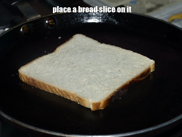 Step 12 – <p><span style="background-color:rgb(255,255,255);color:rgb(0,0,0);">Place a </span><a href="https://www.tarladalal.com/glossary-bread-219i"><u>bread</u></a><span style="background-color:rgb(255,255,255);color:rgb(0,0,0);"> slice on it.</span></p>