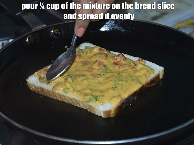 Step 13 – <p><span style="background-color:rgb(255,255,255);color:rgb(0,0,0);">Pour ¼ cup of the <strong>mixture</strong> on the <strong>bread slice</strong> and spread it evenly.</span></p>