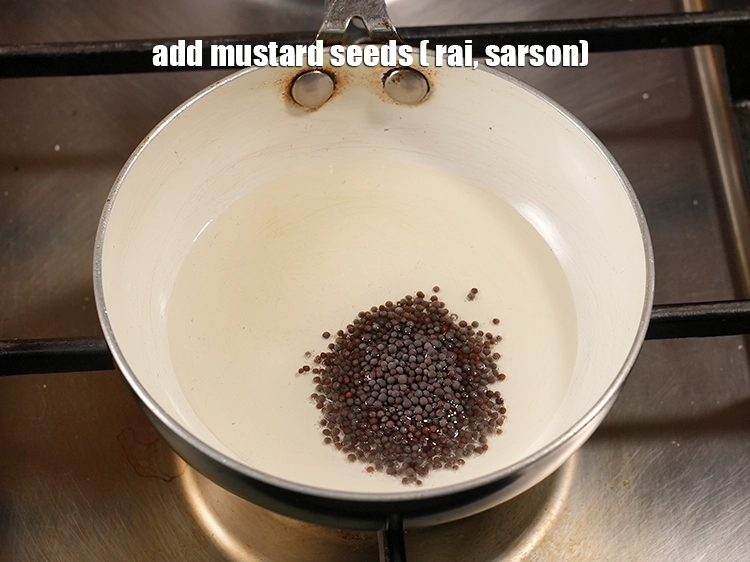Step 4 – <p><span style="background-color:rgb(255,255,255);color:rgb(0,0,0);">Add the 1/2 tsp </span><a href="https://www.tarladalal.com/glossary-mustard-seeds-sarson-rai-sarson-ke-beej-525i"><u>mustard seeds ( rai / sarson)</u></a>.</p>