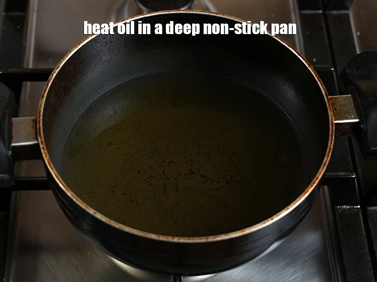 Step 8 – <p><span style="background-color:rgb(255,255,255);color:rgb(0,0,0);">Heat the </span><a href="https://www.tarladalal.com/glossary-oil-671i"><u>oil</u></a><span style="background-color:rgb(255,255,255);color:rgb(0,0,0);"> in a deep non-stick pan.</span></p>