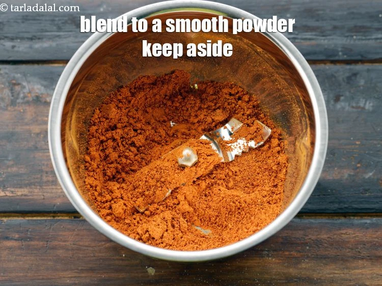 Step 12 – <p><span style="background-color:rgb(255,255,255);color:rgb(0,0,0);">Blend to a smooth powder. Keep the <strong>rasam powder</strong> aside.</span></p>