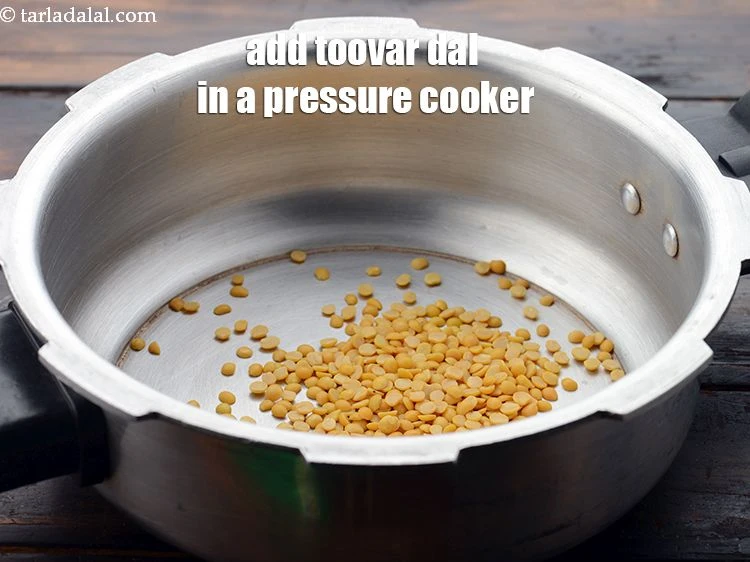 Step 13 – <p><span style="background-color:rgb(255,255,255);color:rgb(0,0,0);">In a pressure cooker, put 2&nbsp;tbsp&nbsp;</span><a href="https://www.tarladalal.com/glossary-toovar-dal-arhar-dal-toor-dal-split-pigeon-peas-tur-dal-955i"><u>toovar (arhar) dal</u></a><span style="background-color:rgb(255,255,255);color:rgb(0,0,0);">.</span></p>