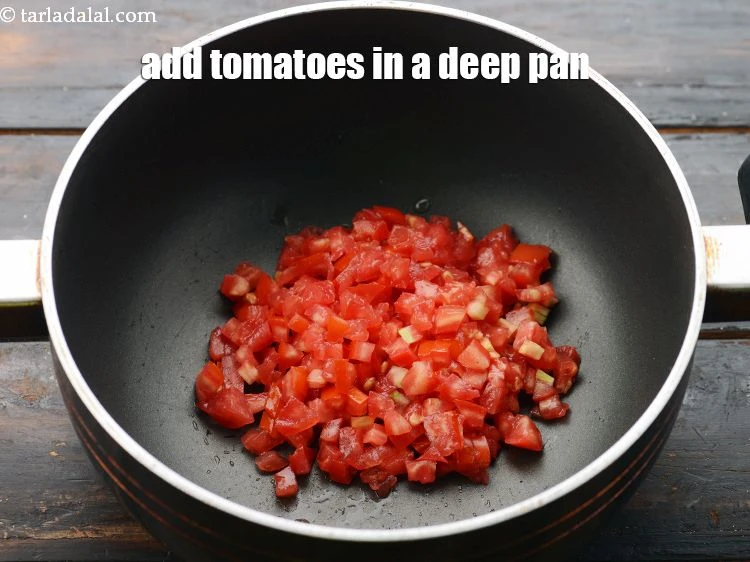 Step 20 – <p><span style="background-color:rgb(255,255,255);color:rgb(0,0,0);">In a deep non-stick pan, add 1/2 cup&nbsp;finely&nbsp;</span><a href="https://www.tarladalal.com/glossary-chopped-tomatoes-779i"><u>chopped tomatoes</u></a><span style="background-color:rgb(255,255,255);color:rgb(0,0,0);">.</span></p>