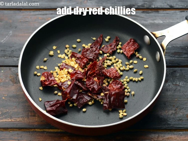 Step 4 – <p><span style="background-color:rgb(255,255,255);color:rgb(0,0,0);">Add&nbsp;3&nbsp;</span><a href="https://www.tarladalal.com/glossary-whole-dry-kashmiri-red-chillies-kashmiri-mirch-kashmiri-lal-mirch-332i"><u>whole dry kashmiri red chillies</u></a><span style="background-color:rgb(255,255,255);color:rgb(0,0,0);">&nbsp;, broken into pieces.</span></p>