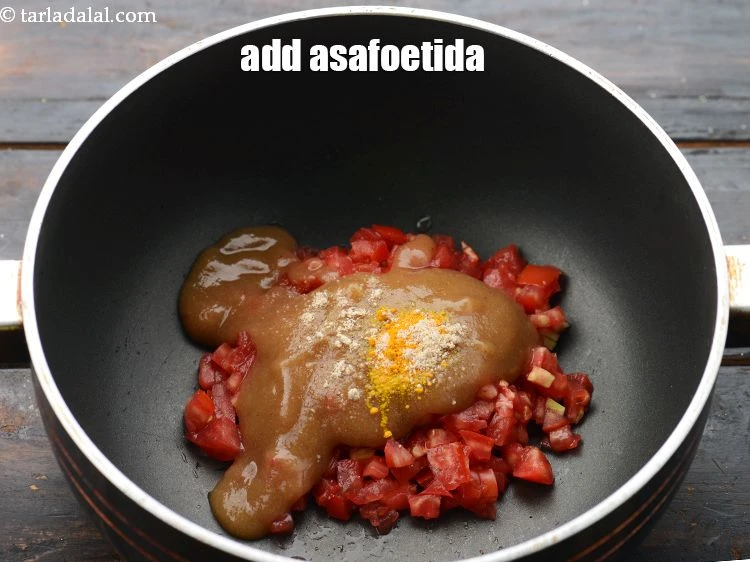 Step 23 – <p><span style="background-color:rgb(255,255,255);color:rgb(0,0,0);">Add&nbsp;a pinch of&nbsp;</span><a href="https://www.tarladalal.com/glossary-asafoetida-hing-113i"><u>asafoetida (hing)</u></a><span style="background-color:rgb(255,255,255);color:rgb(0,0,0);">.</span></p>