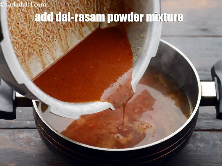 Step 28 – <p><span style="background-color:rgb(255,255,255);color:rgb(0,0,0);">Add the <strong>prepared dal-rasam powder mixture</strong>.</span></p>