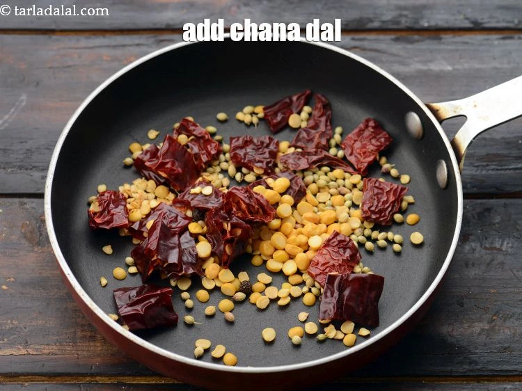 Step 7 – <p><span style="background-color:rgb(255,255,255);color:rgb(0,0,0);">Add&nbsp;1/2 tsp&nbsp;</span><a href="https://www.tarladalal.com/glossary-chana-dal-split-Bengal-gram-285i"><u>chana dal (split bengal gram)</u></a><span style="background-color:rgb(255,255,255);color:rgb(0,0,0);">.</span></p>