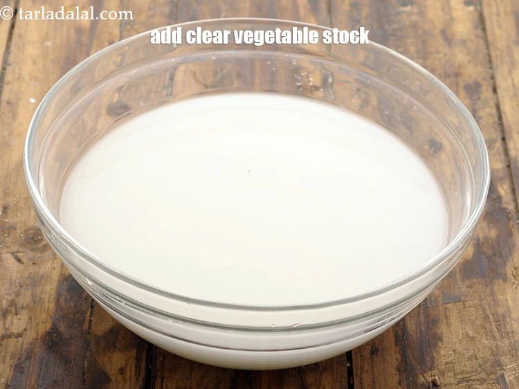 Step 3 – <p>Add <span style="background-color:rgb(255,255,255);color:rgb(0,0,0);">3 cups of </span><a href="https://www.tarladalal.com/clear-vegetable-stock-4181r"><u>clear vegetable stock</u></a>. Ensure it is cold and at …
