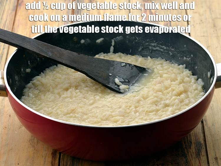 Step 5 – <p><span style="background-color:rgb(255,255,255);color:rgb(0,0,0);">Add ½ cup of </span><a href="https://www.tarladalal.com/basic-vegetable-stock-38556r"><u>vegetable stock</u></a><span style="background-color:rgb(255,255,255);color:rgb(0,0,0);">, mix well and cook on a …