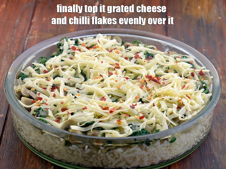 Step 13 – <p><span style="background-color:rgb(255,255,255);color:rgb(0,0,0);">Finally top it 1/2 cup </span><a href="https://www.tarladalal.com/glossary-processed-cheese-315i#ing_3090"><u>grated processed cheese</u></a><span style="background-color:rgb(255,255,255);color:rgb(0,0,0);"> and 1 tsp </span><a …