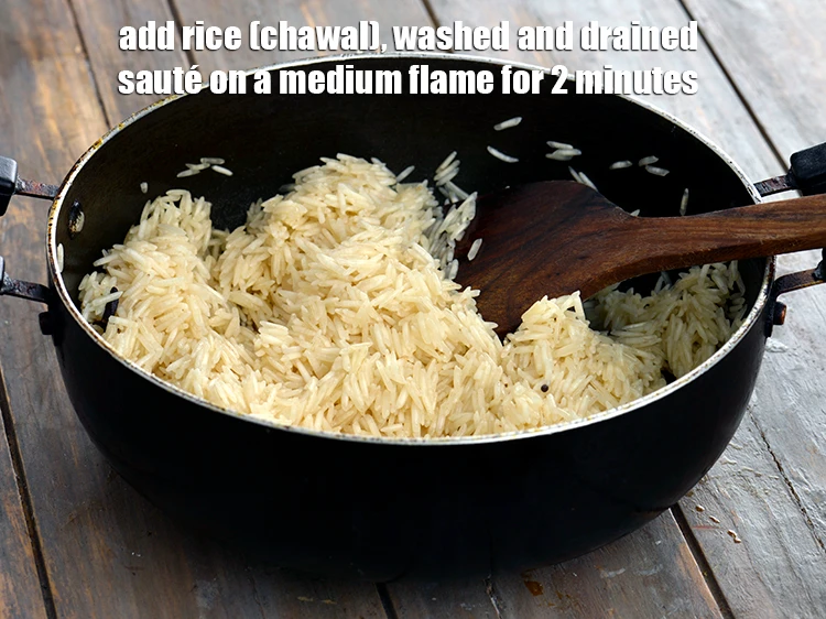 Step 2 – <p><span style="background-color:rgb(255,255,255);color:rgb(0,0,0);">Add the 1 1/2 cups uncooked </span><a href="https://www.tarladalal.com/glossary-rice-chawal-533i"><u>rice (chawal) </u></a><span style="background-color:rgb(255,255,255);color:rgb(0,0,0);">, washed and drained …