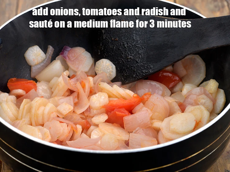 Step 11 – <p><span style="background-color:rgb(255,255,255);color:rgb(0,0,0);">Add the 1/2 cup roughly </span><a href="https://www.tarladalal.com/glossary-onions-pyaz-pyaaz-kanda-548i#ing_2327"><u>chopped onion</u></a><span style="background-color:rgb(255,255,255);color:rgb(0,0,0);">, 1/2 cup roughly </span><a href="https://www.tarladalal.com/glossary-tomatoes-tamatar-639i#ing_2361"><u>chopped …