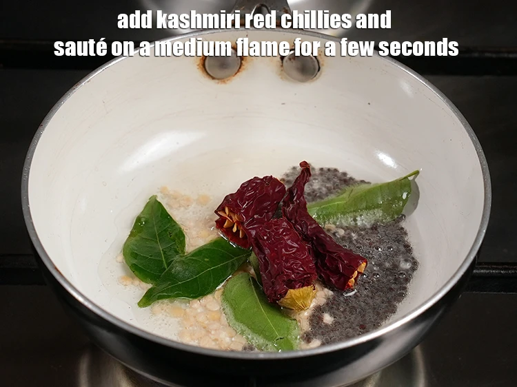 Step 21 – <p><span style="background-color:rgb(255,255,255);color:rgb(0,0,0);">Add the 2 </span><a href="https://www.tarladalal.com/glossary-whole-dry-kashmiri-red-chillies-kashmiri-mirch-kashmiri-lal-mirch-332i"><u>whole dry Kashmiri red chilli </u></a><span style="background-color:rgb(255,255,255);color:rgb(0,0,0);">, broken into pieces. …