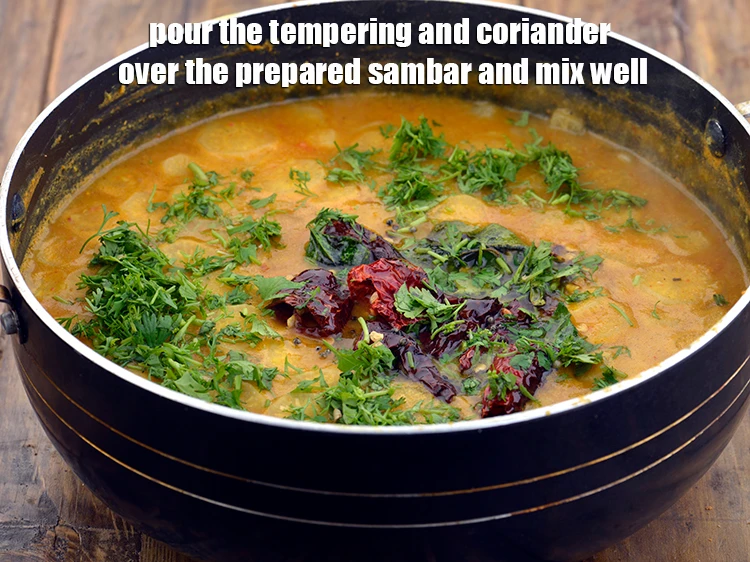 Step 22 – <p><span style="background-color:rgb(255,255,255);color:rgb(0,0,0);">Pour the tempering and 2 tbsp finely </span><a href="https://www.tarladalal.com/glossary-coriander-dhania-kothmir-369i#ing_2365"><u>chopped coriander (dhania)</u></a><span style="background-color:rgb(255,255,255);color:rgb(0,0,0);"> over the …