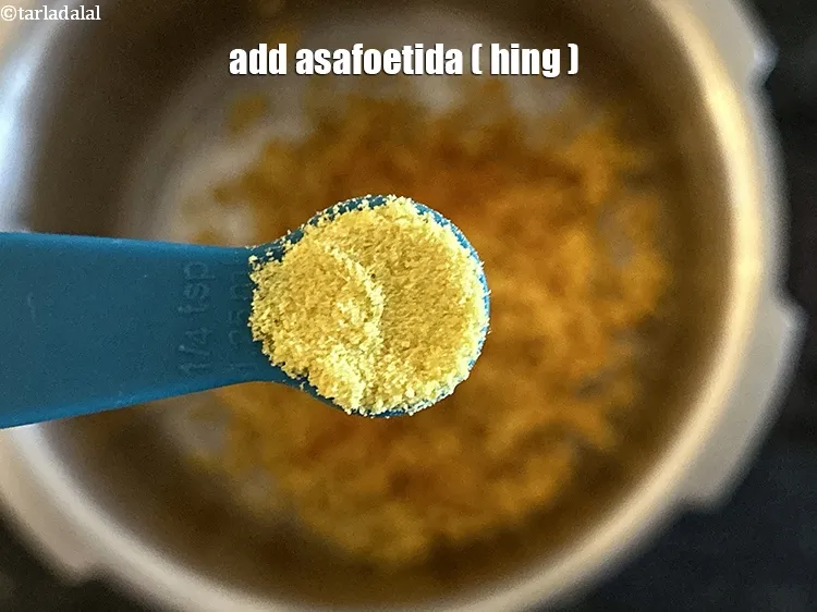 Step 5 – <p>Add the <span style="background-color:rgb(255,255,255);color:rgb(0,0,0);">1/2 tsp </span><a href="https://www.tarladalal.com/glossary-asafoetida-hing-113i"><u>asafoetida (hing)</u></a><u>.</u></p>