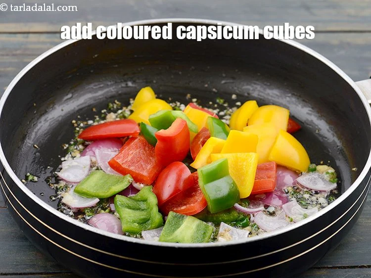 Step 13 – <p>Add 3/4 cup coloured&nbsp;<a href="https://www.tarladalal.com/glossary-capsicum-shimla-mirch-bell-pepper-163i">capsicum</a>&nbsp;cubes.</p>