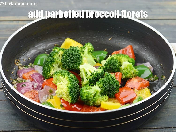 Step 15 – <p>Add 1 cup parboiled <a href="https://www.tarladalal.com/glossary-broccoli-florets-977i">broccoli florets</a>.</p>