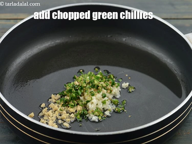 Step 9 – <p>Add&nbsp;2 tsp&nbsp;finely&nbsp;<a href="https://www.tarladalal.com/glossary-chopped-green-chilli-820i">chopped green chillies</a>. If you eat less spicy you can reduce the spice.</p>
