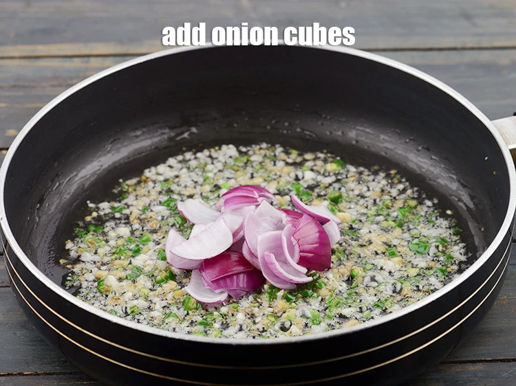 Step 11 – <p>Add ½ cup <a href="https://www.tarladalal.com/glossary-onion-cubes-732i">onion cubes</a> and sauté for 1 minute.</p>