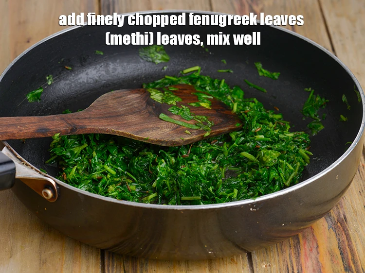 Step 9 – <p><span style="background-color:rgb(255,255,255);color:rgb(0,0,0);">When the seeds crackle, add the fenugreek leaves and mix well.</span></p>