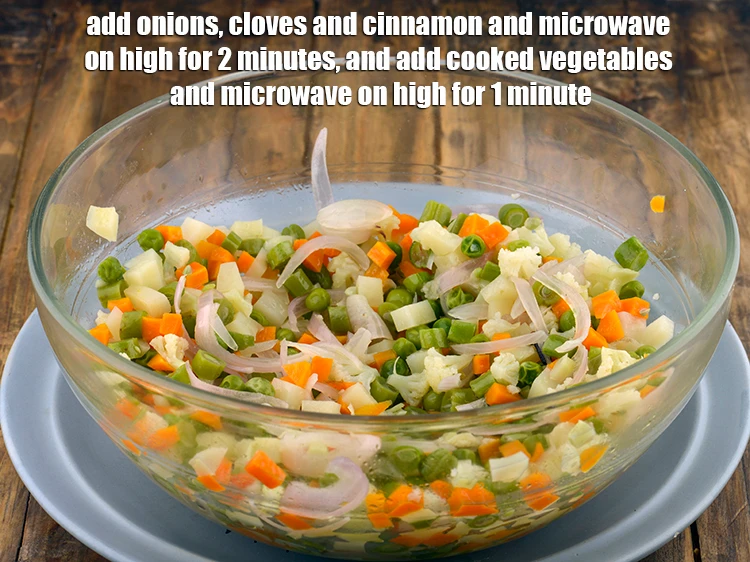 Step 6 – <p><span style="background-color:rgb(255,255,255);color:rgb(0,0,0);">Add the 1/2 cup </span><a href="https://www.tarladalal.com/glossary-onions-pyaz-pyaaz-kanda-548i#ing_2342"><u>sliced onions</u></a><span style="background-color:rgb(255,255,255);color:rgb(0,0,0);">, 3 </span><a href="https://www.tarladalal.com/glossary-cloves-laung-lavang-322i"><u>clove (laung / lavang)</u></a><span …