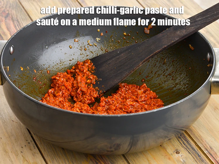 Step 14 – <p><span style="background-color:rgb(255,255,255);color:rgb(0,0,0);">Add the <strong>prepared chilli-garlic paste</strong> and <strong>sauté</strong> on a medium flame for 2 minutes.</span></p>