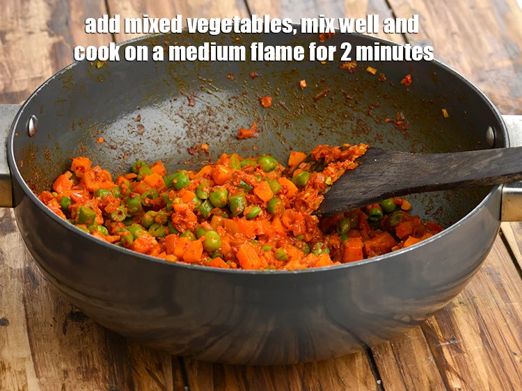 Step 16 – <p><span style="background-color:rgb(255,255,255);color:rgb(0,0,0);">Add the 1 1/2 cups </span><a href="https://www.tarladalal.com/glossary-mixed-vegetables-mixed-sabzi-723i#ing_2543"><u>chopped and boiled mixed vegetables </u></a><span style="background-color:rgb(255,255,255);color:rgb(0,0,0);">(french beans …