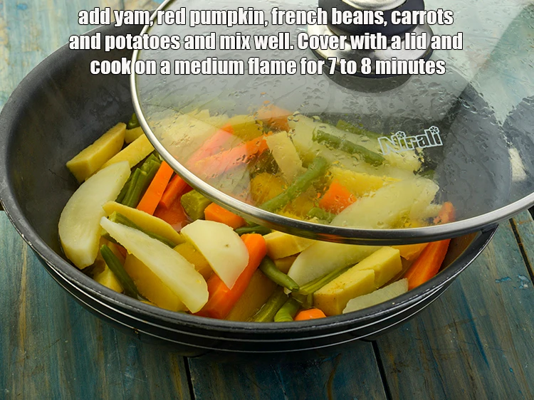 Step 8 – <p><span style="background-color:rgb(255,255,255);color:rgb(0,0,0);">Add the 1/2 cup </span><a href="https://www.tarladalal.com/glossary-yam-ratalu-suran-jimikand-485i#ing_2704"><u>sliced yam (kand)</u></a><span style="background-color:rgb(255,255,255);color:rgb(0,0,0);">, 1/2 cup </span><a href="https://www.tarladalal.com/glossary-red-pumpkin-kaddu-lal-bhopla-bhopla-595i#ing_2447"><u>sliced red …