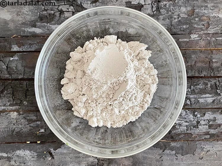 Step 4 – <html><head></head><body><p>In a deep glass bowl put&nbsp;1 cup&nbsp;<a href="glossary-bajra-flour-bajra-ka-atta-bajre-ka-atta-176i">bajra (black millet) flour</a>.</p></body></html>