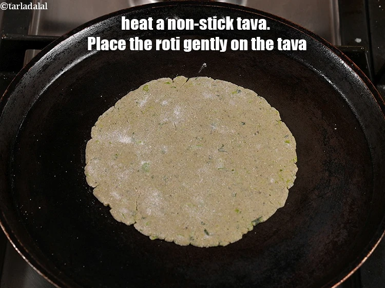 Step 17 – <p>Cook the roti on one side without using any oil for 15 to 30 seconds.</p>