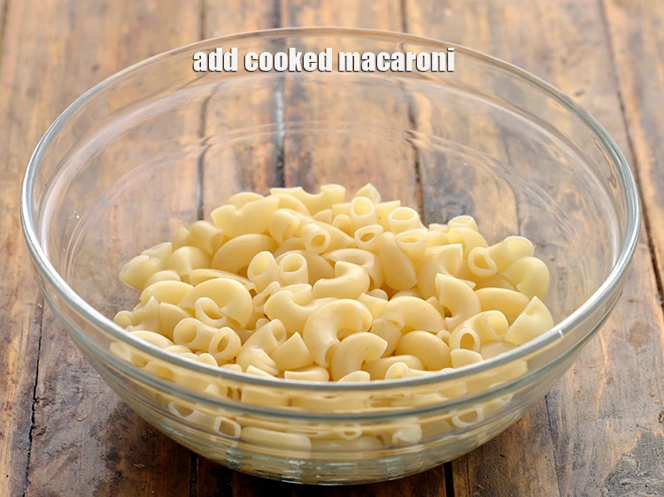 Step 2 – <p><span style="background-color:rgb(255,255,255);color:rgb(0,0,0);">Add 3/4 cup </span><a href="https://www.tarladalal.com/glossary-macaroni-elbow-shaped-pasta-575i#ing_3307"><u>cooked macaroni</u></a>.</p>